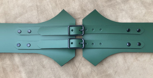 Green Leather Bracers: Make a statement with these bold, green leather wrist guards.